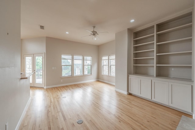 11 Intrepid Cir, Rockwall, TX 75032 - unfurnished living room featuring plenty of natural light, baseboards, ceiling fan, light wood-style flooring, and recessed lighting