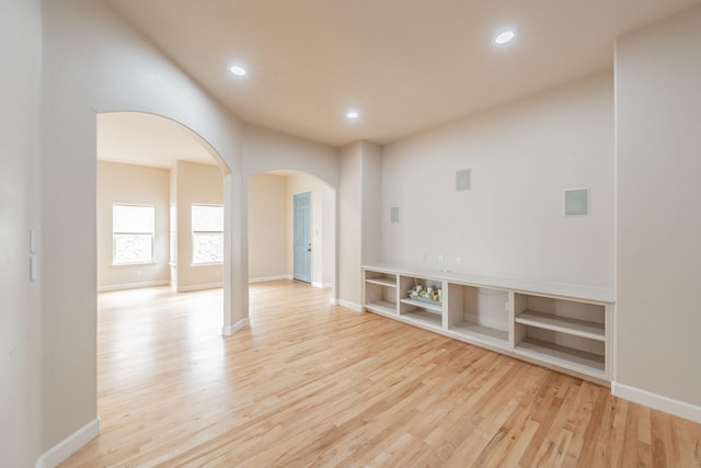 11 Intrepid Cir, Rockwall, TX 75032 - empty room with arched walkways, wood finished floors, recessed lighting, and baseboards