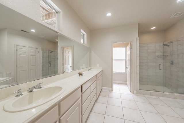 11 Intrepid Cir, Rockwall, TX 75032 - bathroom with a stall shower, plenty of natural light, double vanity, tile patterned floors, and recessed lighting