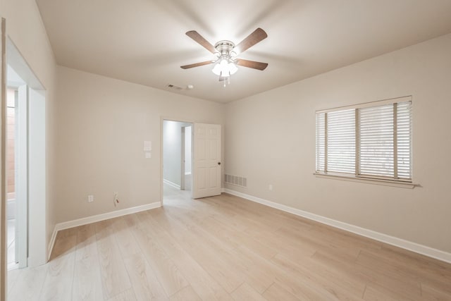 11 Intrepid Cir, Rockwall, TX 75032 - spare room featuring a ceiling fan, light wood finished floors, and baseboards