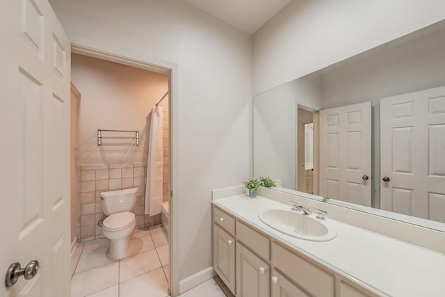 11 Intrepid Cir, Rockwall, TX 75032 - bathroom with toilet, vanity, tile patterned floors, tile walls, and shower / bath combo