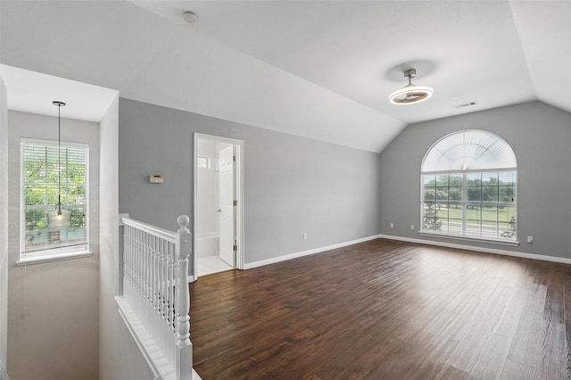 529 Colgate Dr, Allen, TX 75013 - spare room with plenty of natural light, vaulted ceiling, dark wood finished floors, a smoke detector, and baseboards