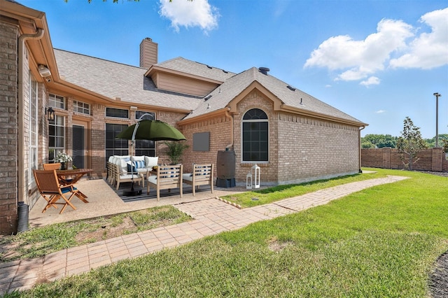 529 Colgate Dr, Allen, TX 75013 - back of house featuring an outdoor living space, brick siding, a patio area, a shingled roof, and a chimney