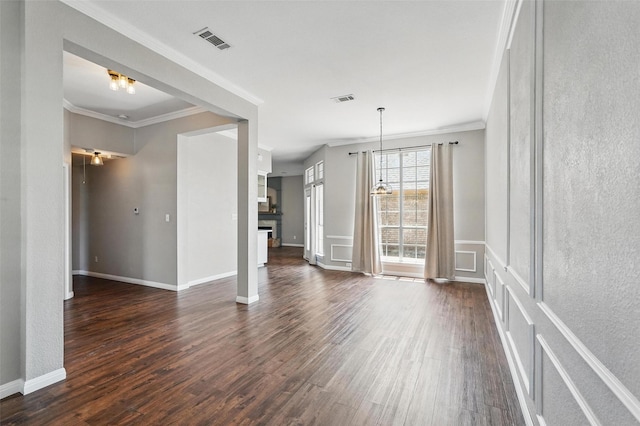 529 Colgate Dr, Allen, TX 75013 - unfurnished living room with dark wood-style flooring, crown molding, baseboards, and a chandelier
