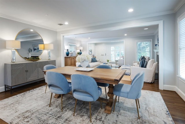 4684 Belclaire Ave, Highland Park, TX 75209 - dining space with wood finished floors, baseboards, healthy amount of natural light, crown molding, and recessed lighting