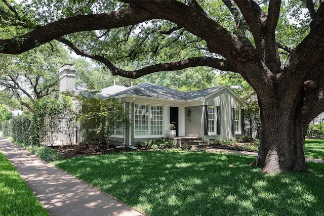 4684 Belclaire Ave, Highland Park, TX 75209 - ranch-style house featuring a chimney and a front lawn