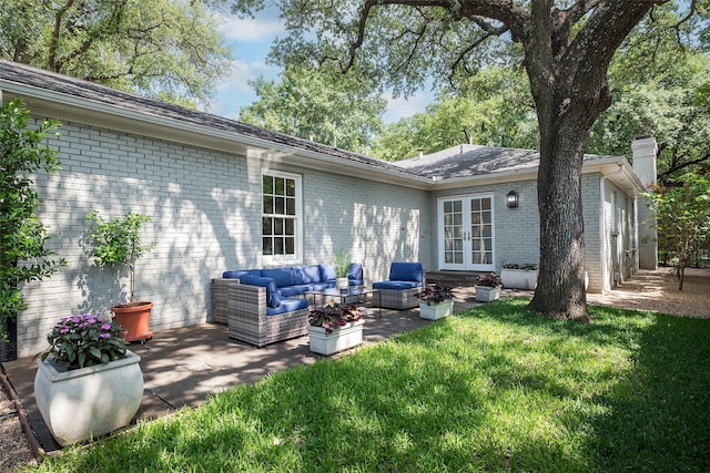 4684 Belclaire Ave, Highland Park, TX 75209 - rear view of house featuring french doors, an outdoor hangout area, a patio, a lawn, and brick siding