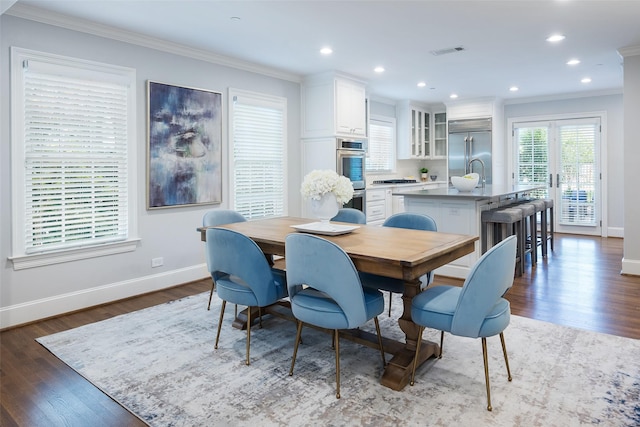 4684 Belclaire Ave, Highland Park, TX 75209 - dining room featuring baseboards, crown molding, dark wood-style floors, and recessed lighting