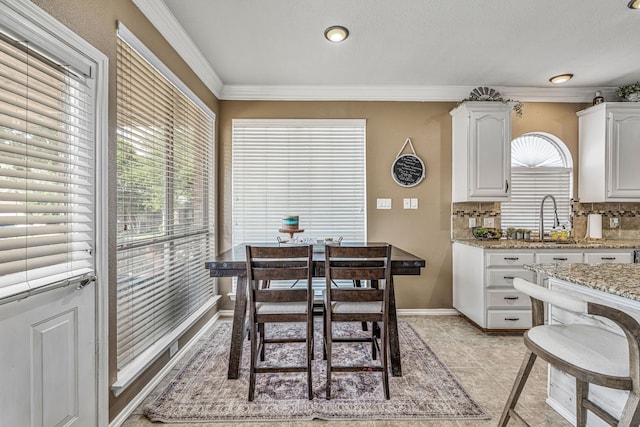 2829 Flint Rock Dr, Fort Worth, TX 76131 - dining area with crown molding, light tile patterned flooring, and baseboards