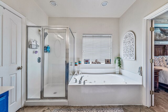2829 Flint Rock Dr, Fort Worth, TX 76131 - ensuite bathroom with a stall shower, a tub with jets, and tile patterned floors