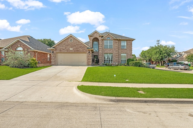 2829 Flint Rock Dr, Fort Worth, TX 76131 - view of front of home featuring an attached garage, concrete driveway, a front yard, and brick siding