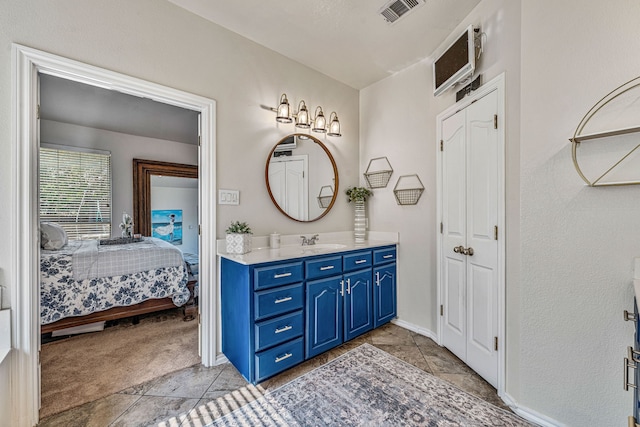 2829 Flint Rock Dr, Fort Worth, TX 76131 - bathroom featuring vanity, connected bathroom, a closet, and baseboards