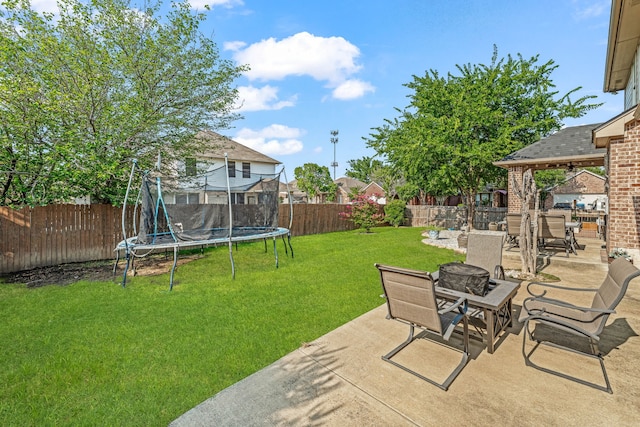 2829 Flint Rock Dr, Fort Worth, TX 76131 - view of yard with a trampoline, an outdoor fire pit, and a patio area