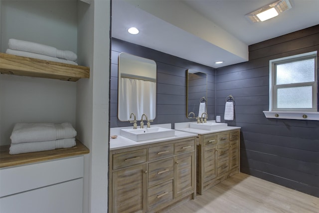 1201 Oakhurst Dr, Southlake, TX 76092 - full bathroom featuring double vanity, wood finished floors, recessed lighting, and wooden walls