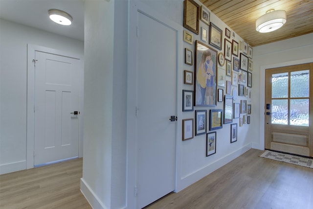 1201 Oakhurst Dr, Southlake, TX 76092 - doorway with light wood-type flooring, baseboards, and wooden ceiling