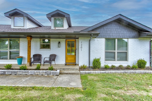 1201 Oakhurst Dr, Southlake, TX 76092 - view of front of property featuring a front lawn, a patio, roof with shingles, and brick siding