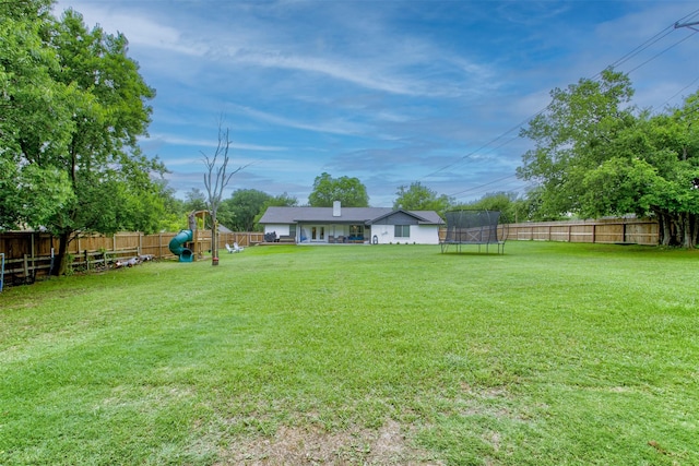 1201 Oakhurst Dr, Southlake, TX 76092 - view of yard featuring a trampoline and a playground