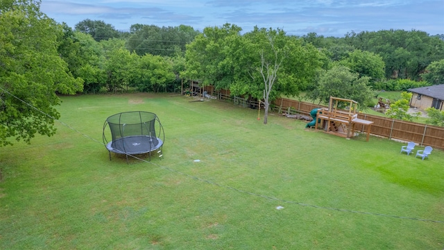 1201 Oakhurst Dr, Southlake, TX 76092 - view of yard with a trampoline and a playground