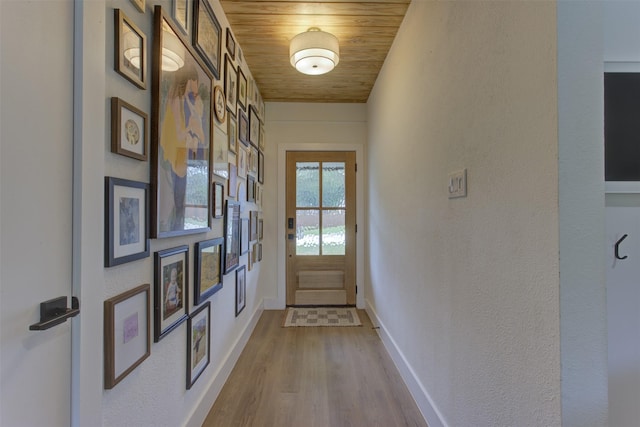1201 Oakhurst Dr, Southlake, TX 76092 - doorway with wood ceiling, wood finished floors, baseboards, and a textured wall