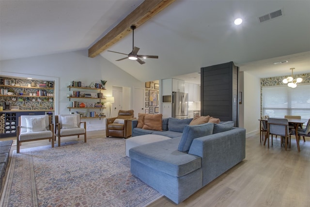 1201 Oakhurst Dr, Southlake, TX 76092 - living area featuring light wood finished floors, a chandelier, and a ceiling fan