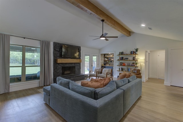 1201 Oakhurst Dr, Southlake, TX 76092 - living room with light wood-style flooring, ceiling fan, and a fireplace