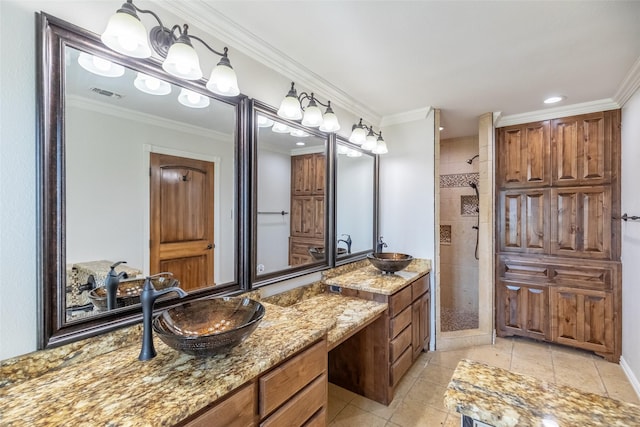4624 County Road 206, Breckenridge, TX 76424 - bathroom featuring tiled shower, vanity, tile patterned flooring, ornamental molding, and recessed lighting