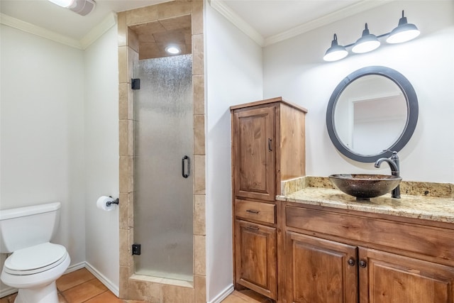 4624 County Road 206, Breckenridge, TX 76424 - bathroom with vanity, a shower stall, toilet, ornamental molding, and tile patterned floors