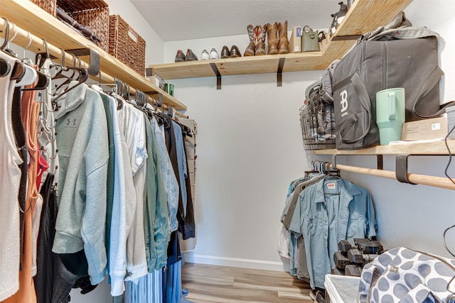 6117 Magnolia Ln, Rowlett, TX 75089 - spacious closet featuring wood finished floors