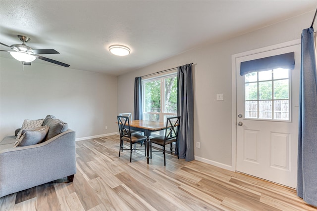 6117 Magnolia Ln, Rowlett, TX 75089 - dining room featuring light wood finished floors, baseboards, and ceiling fan