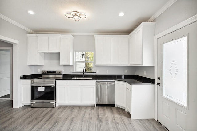 1250 E Morphy St, Fort Worth, TX 76104 - kitchen with stainless steel appliances, a sink, ornamental molding, white cabinets, and light wood-style floors