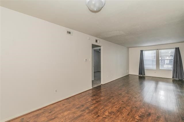5111 Skillman St Unit 128, Dallas, TX 75206 - unfurnished room featuring wood finished floors