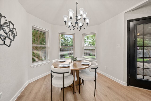 28 Alamosa Dr, Trophy Club, TX 76262 - dining room with light wood-type flooring, a chandelier, and baseboards
