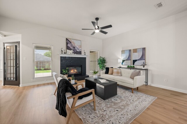 28 Alamosa Dr, Trophy Club, TX 76262 - living room with wood finished floors, ceiling fan, baseboards, and a brick fireplace