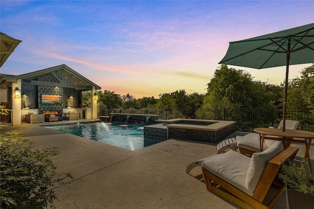 1525 Langford Ln, Celina, TX 75009 - view of swimming pool with a patio, a pool with connected hot tub, and an outdoor living space with a fireplace
