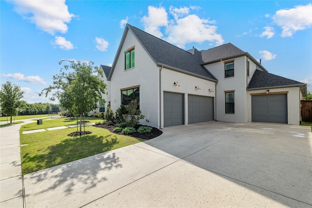 1525 Langford Ln, Celina, TX 75009 - view of side of property with concrete driveway, brick siding, a garage, a yard, and roof with shingles