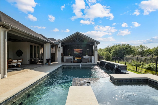 1525 Langford Ln, Celina, TX 75009 - view of pool featuring a warm lit fireplace, a patio, and a pool with connected hot tub