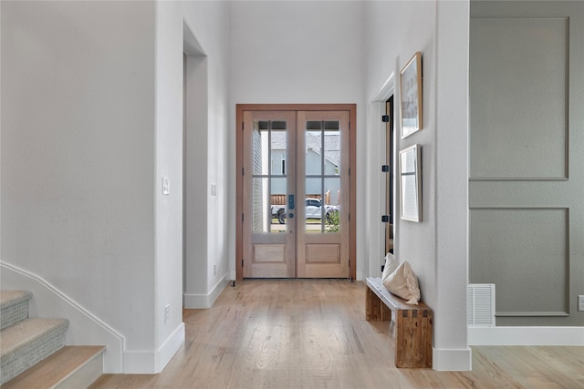 1525 Langford Ln, Celina, TX 75009 - entrance foyer featuring french doors, baseboards, and wood finished floors