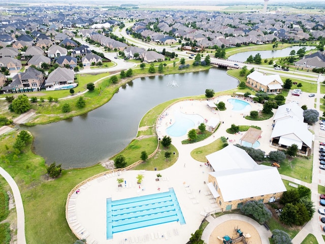 1525 Langford Ln, Celina, TX 75009 - aerial perspective of suburban area with a pool area and a large body of water