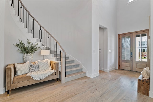 1525 Langford Ln, Celina, TX 75009 - foyer entrance featuring a high ceiling, healthy amount of natural light, wood finished floors, and stairs