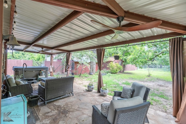 202 E Ross St, Rising Star, TX 76471 - fenced backyard featuring a patio, a ceiling fan, and an outdoor hangout area
