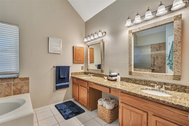 2700 Rochelle Dr, Mckinney, TX 75070 - full bathroom featuring double vanity, tile patterned flooring, a garden tub, a tile shower, and lofted ceiling