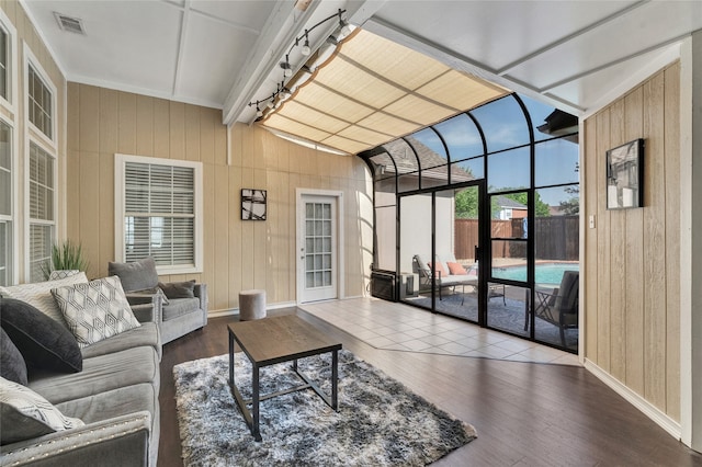 2700 Rochelle Dr, Mckinney, TX 75070 - living room with wooden walls, baseboards, wood finished floors, and a sunroom