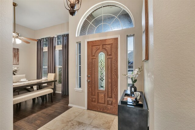 2700 Rochelle Dr, Mckinney, TX 75070 - foyer entrance featuring a textured wall, tile patterned flooring, and a ceiling fan