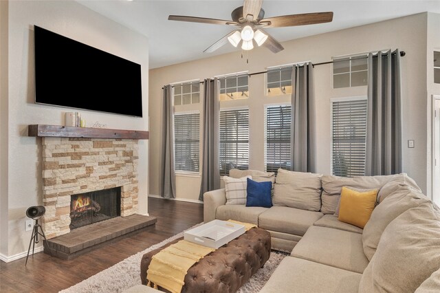 2700 Rochelle Dr, Mckinney, TX 75070 - living area featuring baseboards, a ceiling fan, wood finished floors, and a stone fireplace