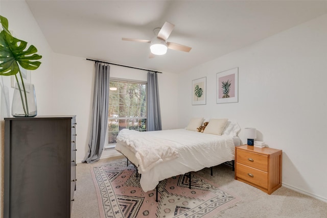 5909 Shady Hill Ln, Arlington, TX 76016 - bedroom with baseboards, a ceiling fan, and light carpet