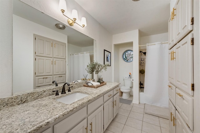 5909 Shady Hill Ln, Arlington, TX 76016 - bathroom with vanity, toilet, tile patterned floors, and shower / bath combo with shower curtain