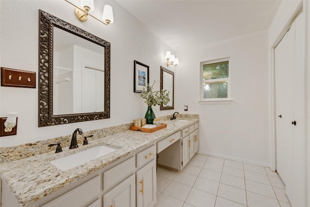 5909 Shady Hill Ln, Arlington, TX 76016 - bathroom with double vanity, tile patterned flooring, and a shower