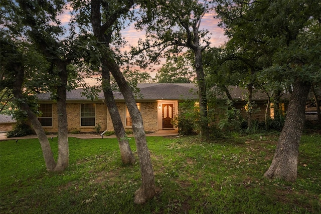5909 Shady Hill Ln, Arlington, TX 76016 - ranch-style home featuring a lawn, brick siding, and roof with shingles