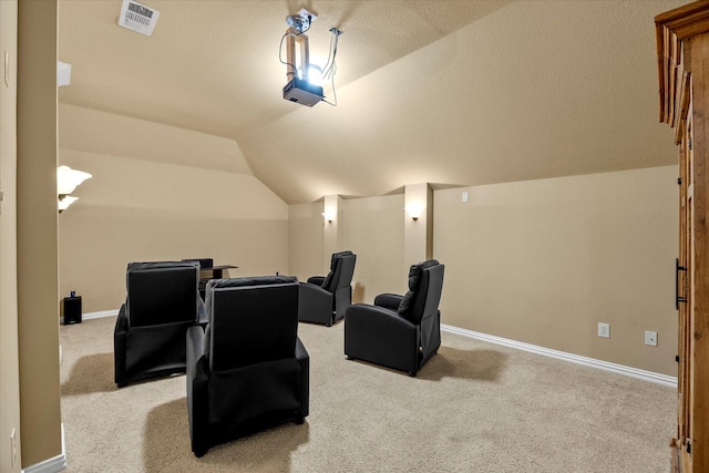 204 Leonard Way, Fate, TX 75087 - cinema room with lofted ceiling, light colored carpet, and baseboards