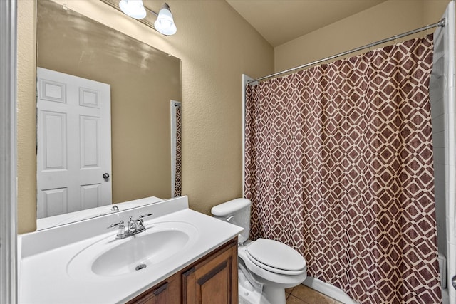 204 Leonard Way, Fate, TX 75087 - bathroom featuring toilet, vanity, a shower with curtain, tile patterned floors, and a textured wall